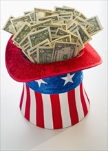 Money in Uncle Sam's hat.