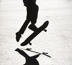 Silhouette of skateboarder. Photographer: fotog