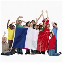 Children holding flag. Photographer: momentimages
