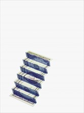 Money folded into shape of steps. Photographer: David Arky