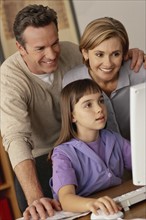 Family looking at computer. Photographer: Rob Lewine