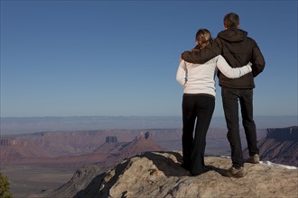 Couple looking at canyon. Photographer: Dan Bannister