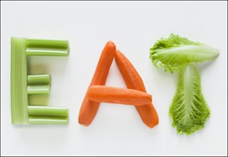 Vegetables spelling the word eat. Photographer: Mike Kemp