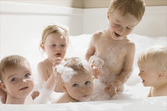 Children having a bath together. Photographer: Mike Kemp