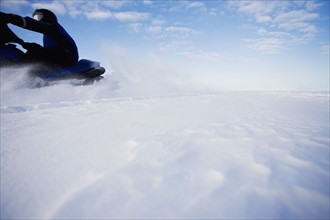 Snowmobile in motion. Photographer: Chris Hackett