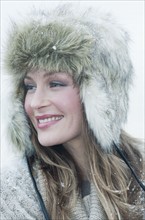 Woman wearing fur hat.
