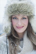 Woman wearing fur hat.