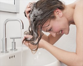 Woman washing hair.