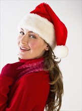 Woman wearing Santa hat.