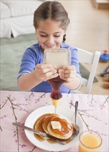 Pancakes and syrup. Photographer: Jamie Grill