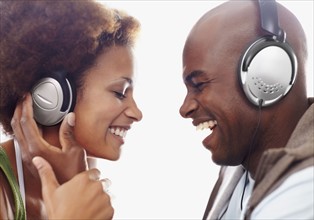 Couple wearing headphones. Photographer: momentimages