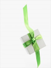 Gift and green ribbon. Photographer: David Arky