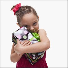 Girl with gift. Photographer: Mike Kemp