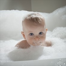 Baby in bathtub. Photographer: Mike Kemp