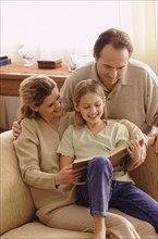 Family reading together. Photographer: Rob Lewine