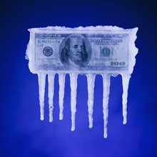 Money covered in ice. Photographer: Mike Kemp