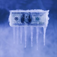 Money covered in ice. Photographer: Mike Kemp