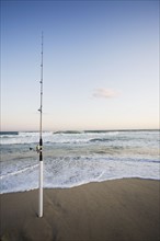 Fishing rod on the beach. Photographer: Chris Hackett