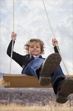 Child on swing. Photographer: Mike Kemp