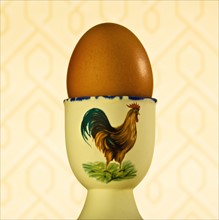 Egg in cup. Photographer: Joe Clark
