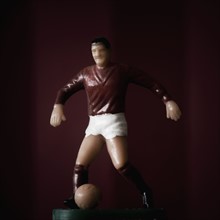Figurine of soccer player. Photographer: Joe Clark