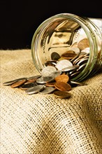 Coins in a jar. Photographer: Joe Clark