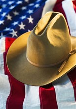 Cowboy hat on American flag.