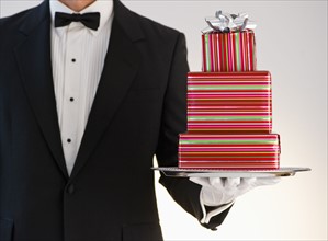 Butler holding gifts.