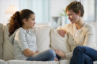 Mother and daughter having a serious talk.