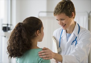 Doctor and patient in pediatrician's office.