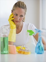 Woman and cleaning supplies.