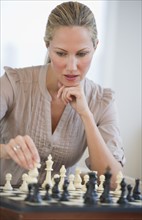 Woman playing chess.