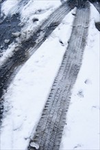 Tire tracks in snow.