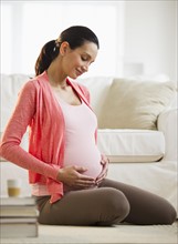Pregnant woman at home.