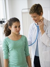 Doctor and patient in pediatrician's office.