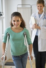 Patient walking on crutches.