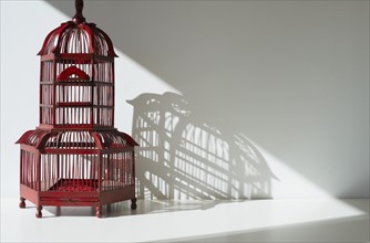 Red bird cage.
