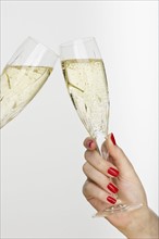 Hand holding champagne glass.