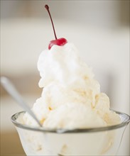 Ice cream with a cherry on top. Photographe : Jamie Grill