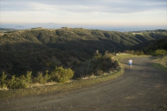Person running on trail.