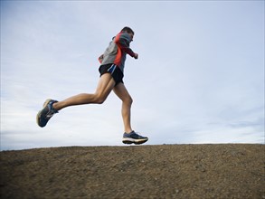 Person running on trail.