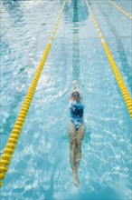 Woman swimming laps.