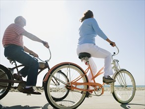 Couple riding bicycles.