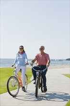 Couple riding bicycles.
