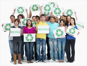 Group of people holding recycle signs. Photographe : momentimages