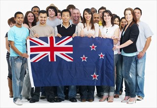 Group of people holding Australian flag. Photographe : momentimages