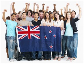 Group of people holding Australian flag. Photographe : momentimages