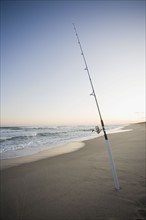 Fishing pole on the beach. Photographe : Chris Hackett