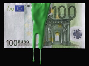 Green paint on a 100 euro bill. Photographe : Mike Kemp