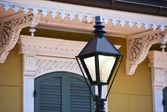 Lamp post in front of house in French Quarter of New Orleans.